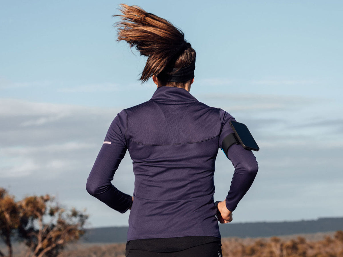 female runner with quad lock running armband