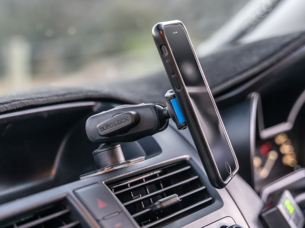 smartphone mounted onto car dashboard for easy navigation