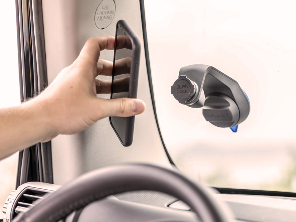 Off road car mount with wireless charging head attached to windscreen