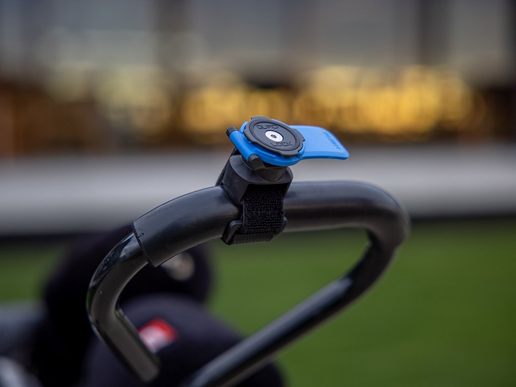 close up of quad lock quick release strap mount on golf cart