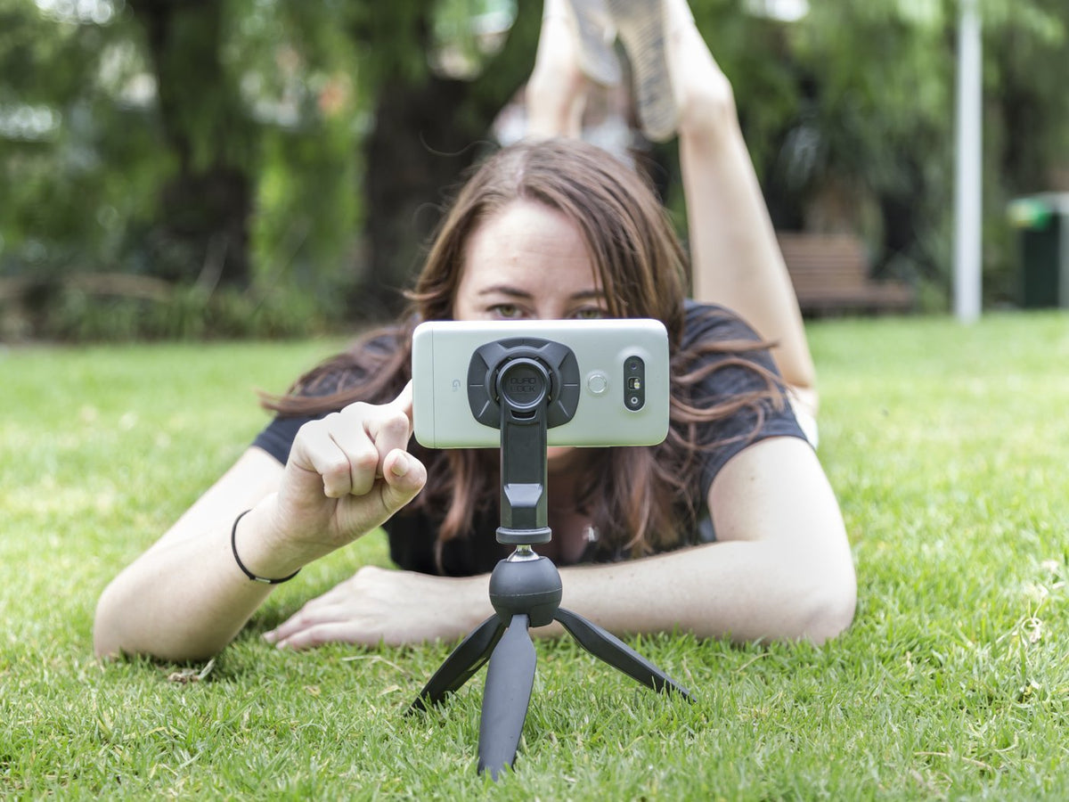 Girl using Tripod adaptor to take photos
